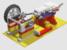 an image of a lego model of a car being worked on by a machine that is built out of legos