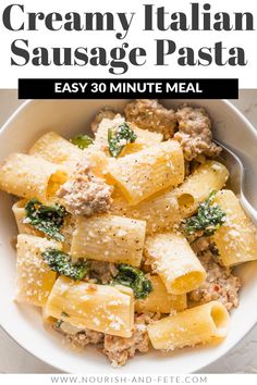 creamy italian sausage pasta in a white bowl