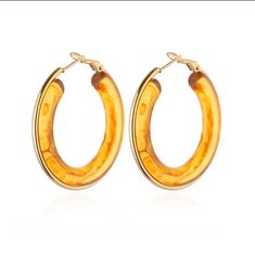 Bold Brilliance: The Acrylic Hoop Earrings Embrace the 2024 trend with these captivating Acrylic Hoop Earrings. Crafted from lightweight and durable acrylic,these earrings offer a vibrant pop of color to any outfit. The polished stainless steel hoops ensure a comfortable and secure fit. Available in a variety of stunning colors, these earrings are perfect for adding a touch of personality and flair to your everyday look. From classic black to playful brights, there's a color to match any mood or Hoop Earrings Aesthetic, Gradient Color Design, Aesthetic Accessories, Acrylic Earring, Earrings Aesthetic, Wedding Party Jewelry, Jewelry Earring, Acrylic Designs, Accessories Wedding