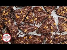 chocolate brownies with walnuts and sea salt are on a baking sheet, ready to be eaten