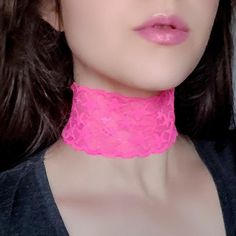 "A super wide star-patterned hot pink choker that's practically glowing! Features comfy stretch lace and adjustable bronze lobster claw clasp and chain closure. Due to the lighting, actual color is best represented in flat lay photos. The length shown in the photos is 11.5\" on a model with a 12\" neck. Each size comes with an additional 2.5\" extender chain. When selecting your stretch choker necklace length, measure around the smallest part of your neck and subtract .5\". If you're in between Adjustable Pink Choker For Festivals, Adjustable Pink Choker For Party, Pink Adjustable Choker For Party, Adjustable Rave Choker For Gift, Adjustable Rave Choker As Gift, Adjustable Rave Choker For Gifts, Pink Rave Jewelry For Festival, Adjustable Pink Trendy Choker, Pink Adjustable Trendy Choker