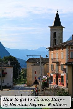 an image of a town with mountains in the background