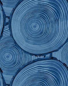 blue circles are arranged on top of each other in an abstract pattern that looks like wood