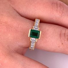 Ladies style Emerald-cut Colombian Emerald mounted in 18k solid yellow gold ring setting with baguette-cut diamond accents. A superb quality Emerald with a vivid, deep green, color hue. The Emerald is mounted in a half-bezel elevated setting, giving the optics of a larger carat size.   Certificate of appraisal included upon request.        Ring Details:  ✔ Ring Size: 8 U.S. (adjustable)  ✔ Ring Weight: 6.5 grams ✔ Gold Purity: 18K   Emerald Details:  ✔ Natural mined Emerald ✔ Cut: Emerald  ✔ Wei Baguette Cut Emerald Ring For May Birthstone, Emerald Cut Emerald Ring With Baguette Diamonds, May Birthstone Baguette Cut Diamond Rings, Classic Green Emerald Ring With Baguette Diamonds, Classic Green Diamond Ring With Baguette Diamonds, Green Emerald Cut Emerald Ring With Baguette Diamonds, Yellow Gold Emerald Ring With Baguette Diamonds, Classic Baguette Cut Green Emerald Ring, Classic Green Baguette Cut Emerald Ring