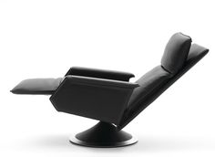 a black recliner chair sitting on top of a metal base in front of a white background