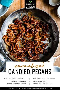 candied pecans in a skillet on a wooden table