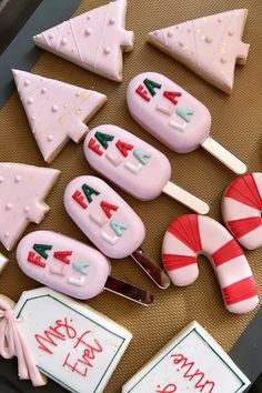 decorated cookies and candy sticks on a table