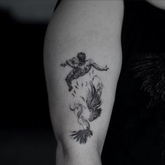 a woman with a tattoo on her arm