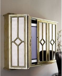 an old cabinet with mirrored doors on the front and sides is being displayed for sale