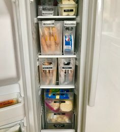 the refrigerator door is open and it has many plastic containers on each side, with food in them