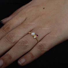 The ring made with genuine ruby gemstone & SI clarity G-H color diamond and 14K solid yellow gold• SKU : NYM-1284• Made to Order.• Gold Purity : 14K Solid Yellow Gold (stamped)• Custom Gold Color: Rose Gold, Yellow Gold, White Gold• Custom Gold Purity: 9K/14K/18K (Charges Apply)• Diamond 100% Genuine Diamond• Diamond Weight : 0.35 ct.• Diamond Color   : G-H color• Diamond Clarity : SI1- SI2• Diamond Cut   : Brilliant Cut (Excellent)• Genuine Ruby Gemstone weight : 0.15 ct.• Genuine Pearl Gemston Gold Diamond Ring With Lab-created Ruby Birthstone, Gold Birthstone Ring With Lab-created Ruby, Dainty Yellow Gold Ruby Ring With Rose Cut Diamonds, Elegant 14k Gold Pearl Ring With Gemstone, Dainty Gold Ruby Ring With Diamond, 14k Yellow Gold Pearl Ring With Birthstone, Dainty Adjustable Yellow Gold Pearl Ring, Adjustable 14k Gold Minimalist Pearl Ring, Minimalist 14k Yellow Gold Pearl Ring