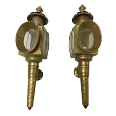 two antique brass wall lights on white background