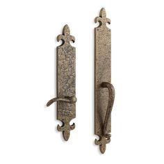 two antique style door handles on white background