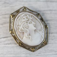 "HERE ARE THE DETAILS YOU NEED N5989 Antique 14K White Gold Carved Shell Cameo Lady Brooch Filigree Pendant Luxury BEAUTIFUL LADY W/ FLOWERS. HAND CARVED SHELL. FINEST DETAIL AMAZING BROOCH PIN WONDERFUL HIGHEST QUALITY. MINOR WEAR TO CAMEO SOME WHITE ON BACK, FRAME HAS MINOR BENDS. JUST PART OF MY MOST RECENT ESTATE FINDS! FOLLOW ME TO SEE THEM ALL! Metal Purity: Metal: 14K White Gold Material: Carved Shell Cameo Lady Form: Brooch Filigree Pendant Luxury Size :1 3/8 x 1 1/8\" Age: Antique Weigh Antique Wedding Brooch With Intricate Design, White Ornate Brooch For Formal Occasions, Ornate White Brooches For Formal Occasions, White Ornate Brooches For Formal Occasions, Antique White Brooches For Wedding, Heirloom White Brooch For Formal Occasions, Heirloom Style White Brooch For Formal Occasions, Heirloom White Brooches For Formal Occasions, Antique Filigree Brooch For Formal Occasions