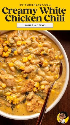 a bowl of creamy white chicken chili with corn on the side and a spoon in it