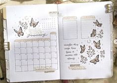 an open planner with butterflies on it