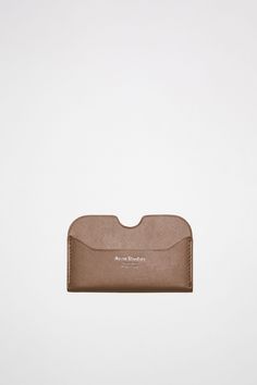 Acne Studios camel brown card case is made of soft, luxurious leather with a polyester finishing on the back. Silver Logo, Stamp Making, Logo Stamp, Card Holder Leather, Small Leather Goods, Cow Leather, Card Case, Card Wallet, The Back