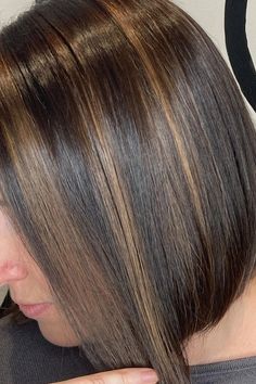 Woman with chocolate brown hair enriched with subtle caramel highlights. Chocolate Brown Hair With Caramel, Brown Hair With Caramel, Chestnut Brown Hair, Subtle Blonde Highlights, Brown Hair With Caramel Highlights