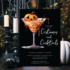 a halloween cocktail party with candles and pumpkins