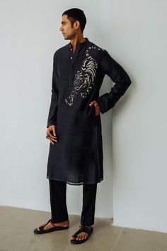 Charcoal black chanderi kurta with resham hand embroidery. Comes with pant. Components: 2 Pattern: Hand embroidered Type Of Work: Resham Neckline: Band collar Sleeve Type: Full Fabric: Chanderi Color: Black Other Details:  Closure : Kurta - Front buttons Occasion: Sangeet - Aza Fashions Black Designer Kurta For Men, Mens Black Kurta Designs, Black Jamawar Kurta With Resham Embroidery, Black Transitional Kurta, Men’s Black Kurta, Mens Kurta Designs, Band Collar, Kurta Designs, Black Charcoal