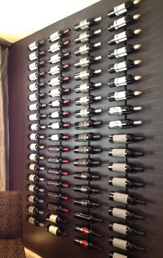 a wine rack is mounted on the wall next to a chair