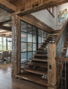 a wooden stair case in a large room