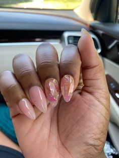 I fondly call this set "Sandy Sells Seashells" because I encapsulate actual broken seashells on the accent fingers. I used the Black-owned Triple O Polish in shade Aneke for the thumb, ring, and pinky fingers. I then apply a clear hard gel overlay to each nail for maximum long wear and durability. This might be my favorite set I've designed thus far. Aren't they simply darling? *Expect slight variations in design due to the hand-made nature of this product. *For all other modifications, inquirie Sparkly Vacation Nails, Sheer Pink Nails With Design, Pink Bubble Bath Nails, Foil Flake Nails, Almond Nail Sets, Almondetto Nails, Dressy Nails, Oyster Nails, Island Vacation Nails