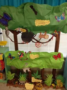 a classroom display with animals and plants on it