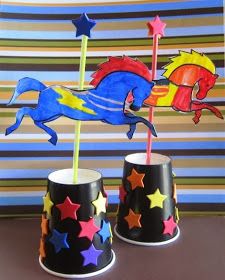 two cups that have different colored stars on them, one has a horse and the other has a fish