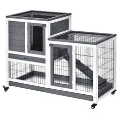 two large cages with one open and the other closed on wheels, each containing an animal cage