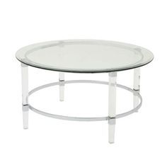 a round glass table with metal legs