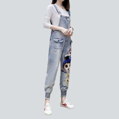 Introducing our streetwear-style Ornamented Women's Denim Jumpsuit from the 2023 Spring-Summer Collection. A sartorial blend of vogue modern and nostalgic vibes. this jumpsuit will make you stand out from the crowd!Distinctive Features: Embroidered Street Style: Get ready to turn heads with this street-trend jumpsuit ââ‚?patterned with eye-catching embroidery for an undeniably cool look. Slim Fit: Crafted to hug your silhouette. this jumpsuit ensures comfort and style so you can look your best. Cats Embroidery, Womens Denim Jumpsuit, Nostalgic Vibes, Style Jumpsuit, Jean Overalls, Jumpsuit Online, Street Trends, Streetwear Style, Current Fashion Trends