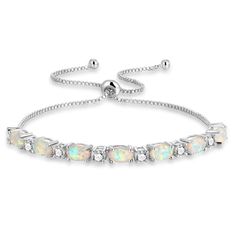 PRICES MAY VARY. ⚡ Silver gold plated ajustable opal bracelet, Lead-Free & Nickle-Free. High quality craft and AAA Cubic Zirconia.The sliding box chain is adjustable to fit most wrist.You will get so many compliments on it. ⚡ Design idea : Inspired by the Caribbean ocean, the stunning white colors in this stone makes it a perfect fashion bracelet .and the size of the bracelet could be easily adjust for the perfect fit. ⚡ Gifts for Women : The ajustable bracelet comes in a beautiful leatherette g White Opal Bracelet, Bracelets Trendy, Bracelets Adjustable, Opal Bracelet, Gold Plated Bracelets, Pink Opal, Bracelet For Women, White Opal, Dainty Jewelry