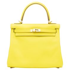 The Hermés Kelly bag embodies the quintessence of style and luxury due to its impeccable design, craftsmanship, and significance. That being said, it is the most iconic and desired piece from the Hermés handbag collection. Hermes Special Order Kelly, Hermes Kelly Jaune Poussin, Hermes Kelly Limited Edition, Hermes Yellow, Limited Edition Hermes Bags, Rare Hermes Bags, Canvas Leather Tote Bag, Hermes Style, Kelly Cut