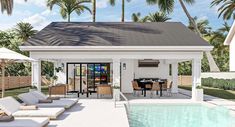 a pool house with an outdoor dining area next to it and palm trees in the background