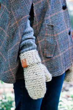 a woman in plaid coat and mittens with text overlay that reads chunk knit mittens free crochet pattern