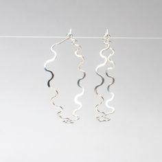 Make a style statement with these versatile and chic hammered hoop earrings. Lightweight and simple, they're designed to add a touch of sophistication to any outfit. The best part? They're so versatile, you'll find yourself reaching for them every day. Whether you're dressing up or keeping it casual, these earrings go with literally everything in your wardrobe. Each pair is handcrafted ensuring that no two are exactly alike. So, go ahead and make waves with these stylish and unique hammered hoop Modern Hammered Earrings For Everyday, Modern Small Hoop Hammered Earrings, Modern Hammered Small Hoop Earrings, Modern Small Hoop Earrings Hand Forged, Modern Hammered Drop Hoop Earrings, Modern Hand Forged Hoop Earrings, Hammered Hoop Earrings, Make Waves, Classic Earrings