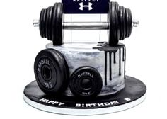 a birthday cake made to look like a weight machine with the words happy birthday on it