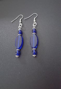 Blue Polished Beaded Earrings For Gifts, Blue Beaded Earrings With Polished Beads As Gift, Blue Beaded Earrings As Gift, Elegant Beaded Earrings With Oval Beads, Elegant Oval Beaded Earrings, Elegant Oval Beaded Earrings As Gift, Elegant Blue Oval Beads Jewelry, Elegant Oval Beaded Earrings For Gift, Elegant Blue Oval Beaded Jewelry