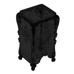 a black glass box with an ornate design on the front and bottom, is shown