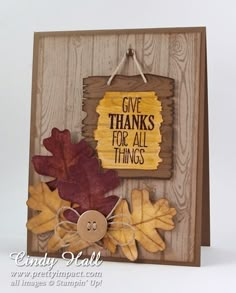 a card with some leaves on it and a tag that says give thanks for all things