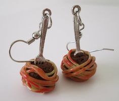 [Spaghetti and Meatball Earrings] These were handcrafted using nontoxic polymer clay measure around 1" from top to bottom. Wiring is made from hypoallergenic materials. Available as earrings and single charms. Charms are sold as individual pieces and will come with one jump ring attachment. Silly Earrings, Spaghetti Monster, Crazy Earrings, Flying Spaghetti Monster, Etsy Stuff, Food Earrings, Polymer Clay Jewelry Diy, Spaghetti And Meatballs, Clay Jewelry Diy