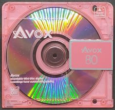 the cd is pink and has colorful lights on it