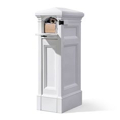 a white pedestal with a door on the side and a keyhole in the middle