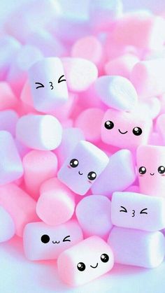 marshmallows with faces and eyes are shown in the image, as if they were candy