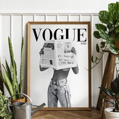 a woman reading a magazine in front of some houseplants and potted plants