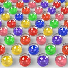 many different colored balls are arranged together