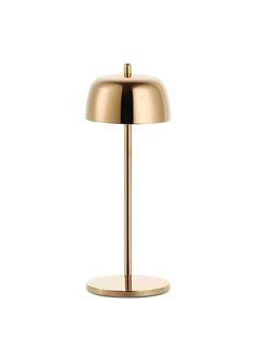 a gold lamp on a white background with the light turned off to show its dim lighting