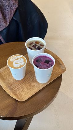 two cups of different types of food on a tray