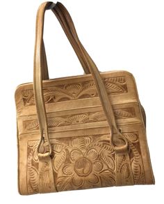 Beautiful Cream leather bag  Handmade / Hand Tooled in Mexico by Avelar.  Boho Satchel Bag Purse Handbag  True vintage heirloom piece from 60’s  Double Hand Strap Handles Zip Closure 4 Exterior Slip Pockets 1 Interior Slip Pocket 1 Interior Zippered Pocket 2 Zippered Divided Compartments Floral Design Motif Approx Measurements: Width 12” height 10” depth 5” drop 6” My home is Pet & Smoke Free! 3C Tote 1 0222-46